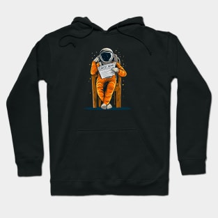 Astronaut reading news from Earth Hoodie